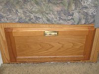 Drop-down door in front of drawer under dinette seat. 
IMG 1695