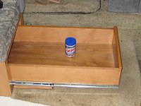 Slide-out drawer under dinette seat. It uses two 100 lb capacity rails. 
IMG 1696