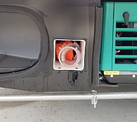 Mod Sewer Hose Storage.  Copied idea from YouTube video posted by Doug Kleven.  Pretty smart guy. 
20' of Rhino hose with all attachments fits in here. 
Has a black rubber top that keeps everything...