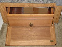 Front of under dinette drawer showing barrel latch to hold it in place when traveling. 
IMG 1698