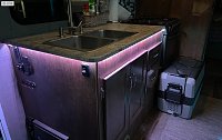 More touches added today. I added another LED strip, this time under the kitchen counter. I hid the plugs/wires inside the wall, and the picture you see with the faceplate, and the little LED...