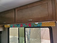 Reupholstered the valances.  Shortened them as well.