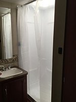 We hated the shower door in the 31H so we removed it and added a bar and shower curtain.  The inexpensive shower curtain from IKEA is perfect.