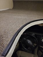Edged carpet with automotive trim
