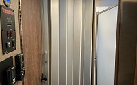 Installed a solid vinyl folding door to replace the fabrics one that let too much light into the bedroom in the morning.