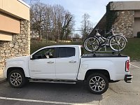 Carrying our bikes on retractable tonneau crossbars