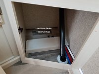 Low Point Drain valves located under the bathroom wardrobe.