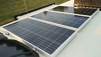 I have three 100W Renogy panels on struts.  The panels are shifted street side so I have a path to walk forward on the roof.  The struts are screwed down with eternabond-wrapped spacers so water can...