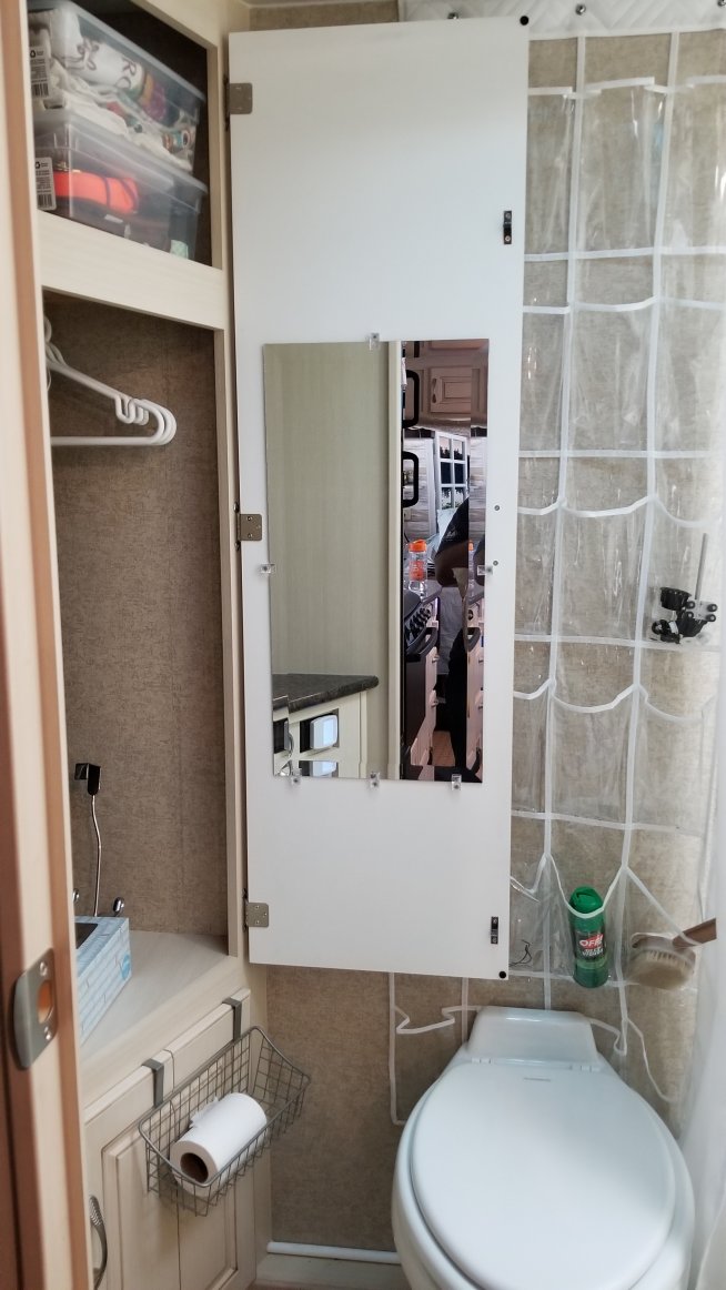 Mirror added to inside of bathroom closet door.