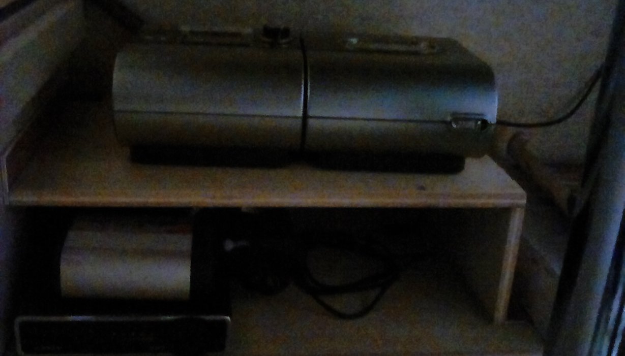This is old man's CPAP machine. I built a small shelf with a 12 volt battery pack with inverter to run while dry camping. This is mounted on curb side wheel well under booth. Air line runs behind booth seat and up to bed. I added an extra air hose to allow for distance.