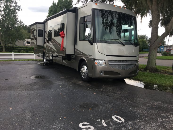 Delivery Day!

Lazy Days RV in Seffner, Florida delivers our 2016 Adventurer 37F on the "Delivery Lot" with a big red bow! We spent one night in the coach to "check it out" for problems. Found a couple minor things that needed repair.