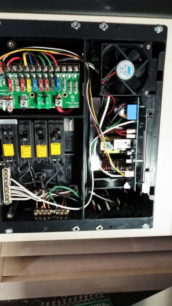 AC wires are connected below.  Converter +/- are connected above.  Branch circuit wires and corresponding fuses are methodically moved one at a time.  Finally the board is pushed into place with some difficulty, but it worked.
