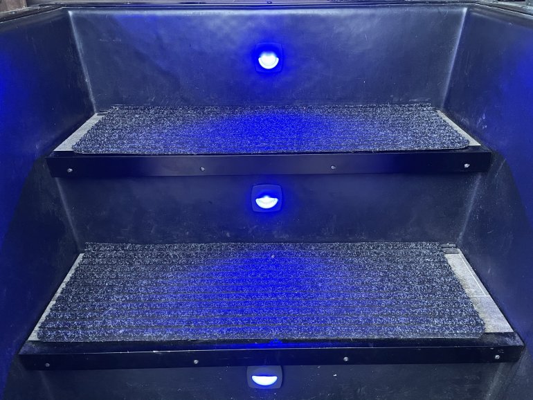Blue step lights, inspired by marine applications on board boats. Actuated whenever the outdoor light is on. Now if I get a lawsuit for falling down the stairs, I can argue I mitigated the danger as best I could.