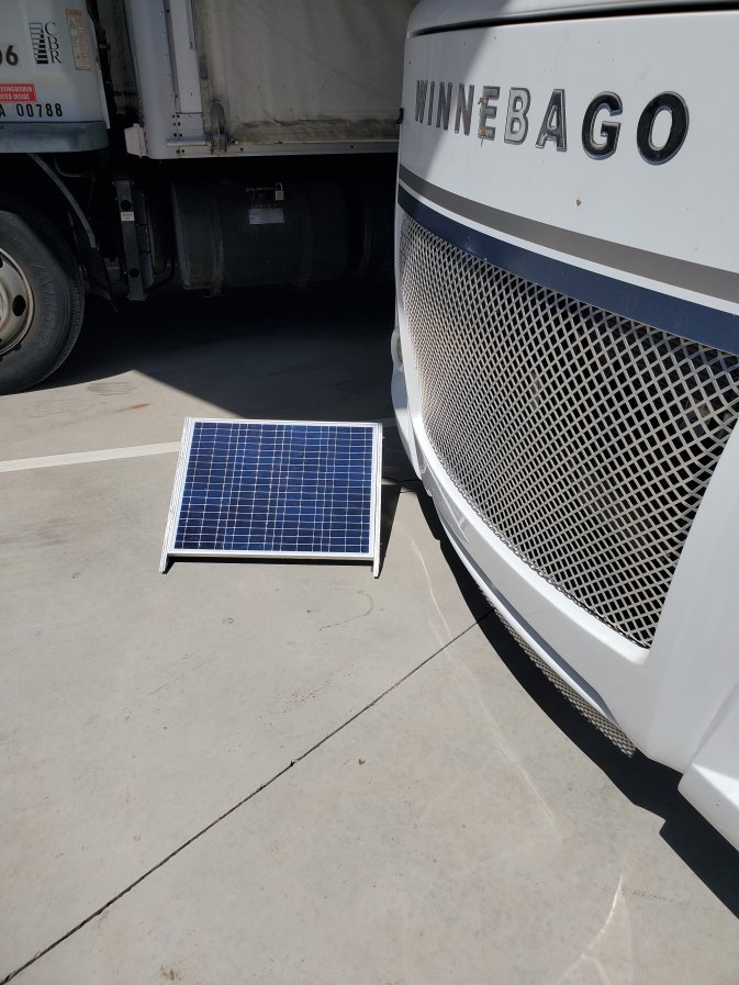 Movable solar panels for charging the batteries while in covered storage.