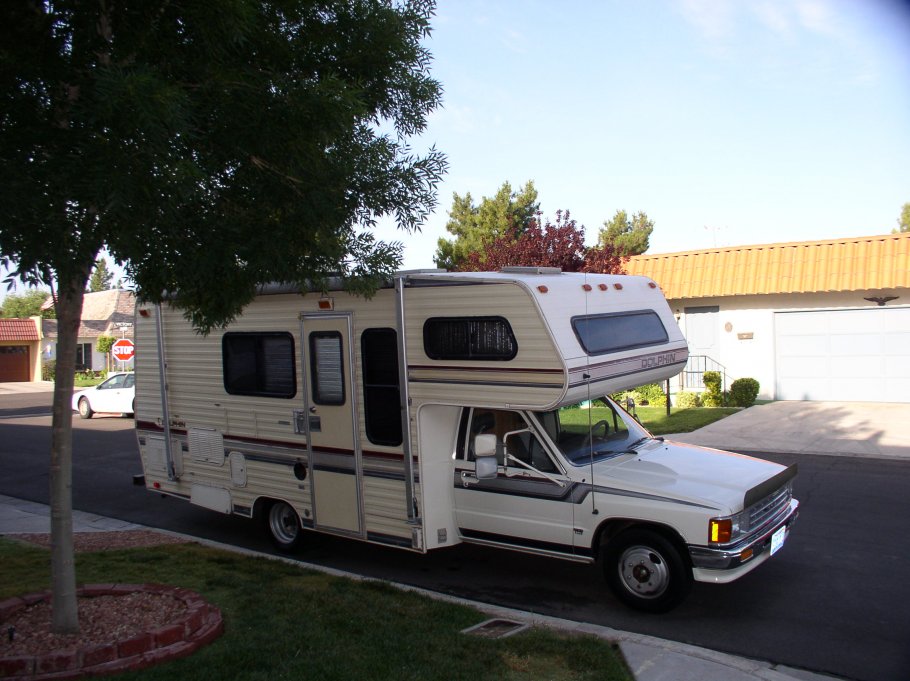 1988 Dolphin RV Toyota 4 cyl engine.  
1st and longest owned, best on gas, but worst on uphill climbs and living space, but due to military assignment the wife and I lived in it full time for three years to keep ourhouse in another location.